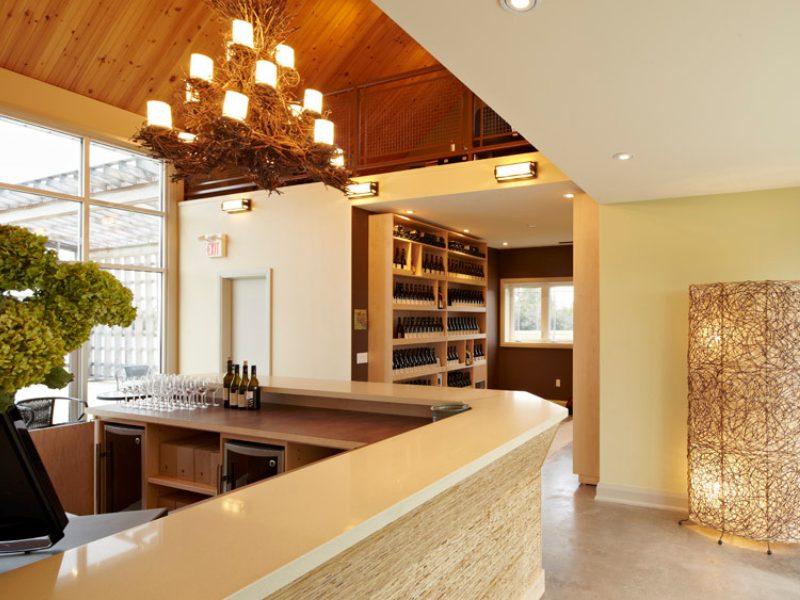a room with a bar and a large window.