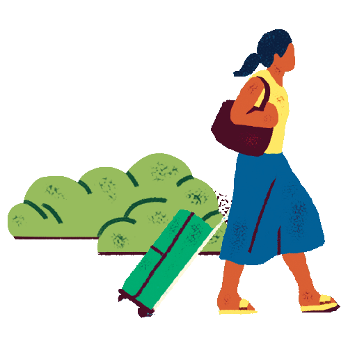 a woman walking with a rolling suitcase.