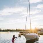 a girl on a paddle board in the water.