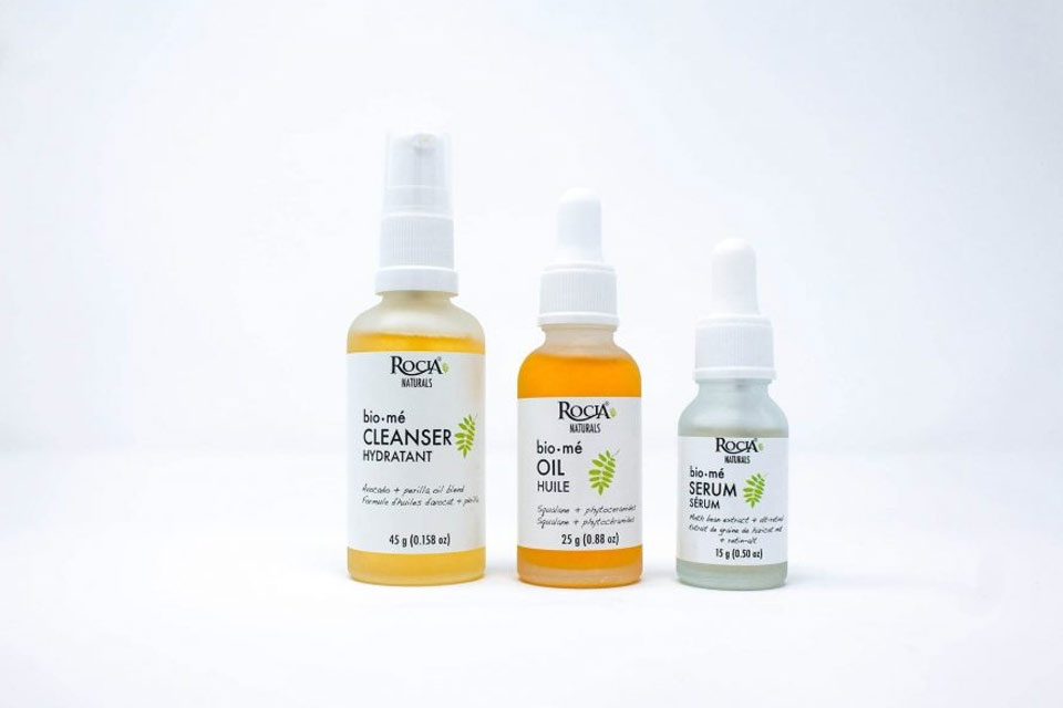 three bottles of facial cleanser sitting next to each other.