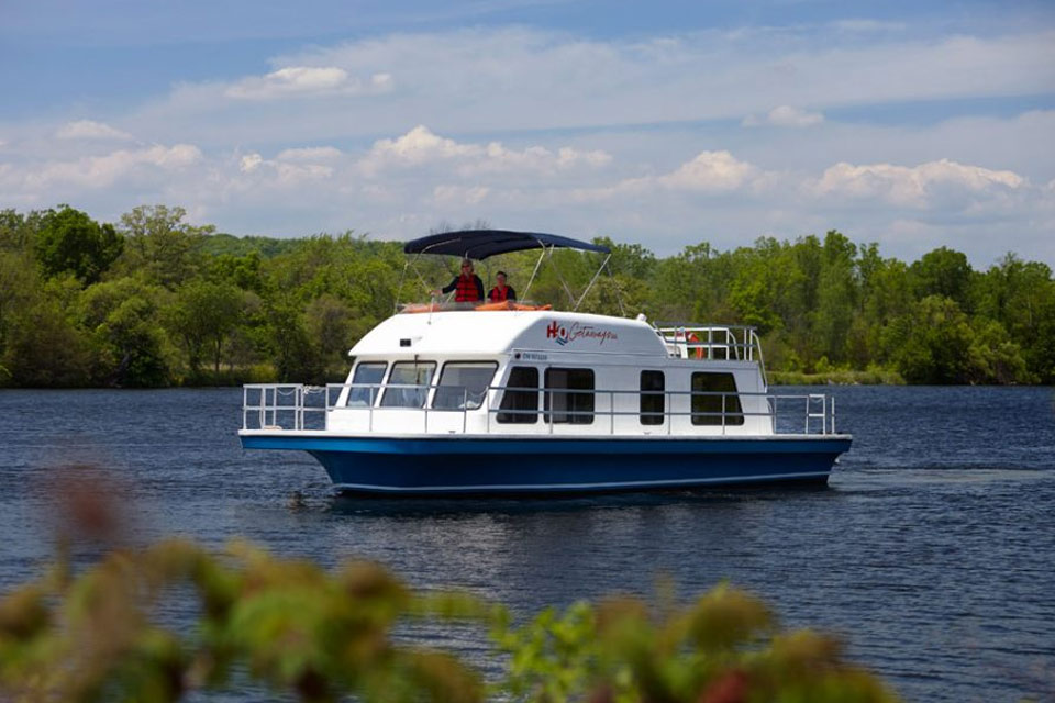 a white and blue boat on a body of water.