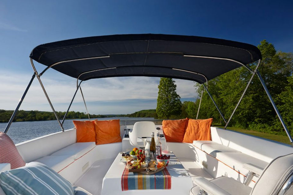 a table is set up on the back of a boat.