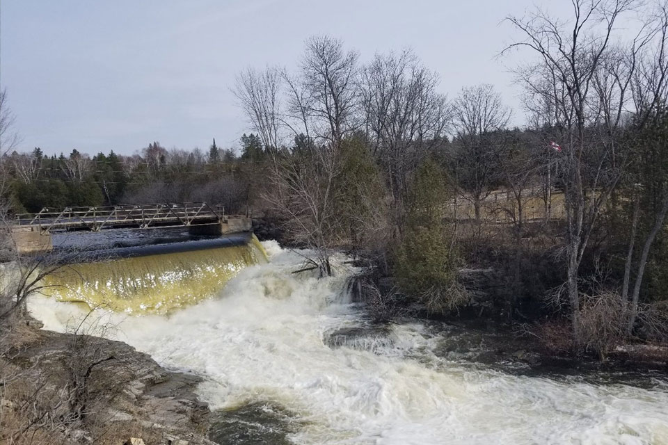 a view of a river with a bridge over it.