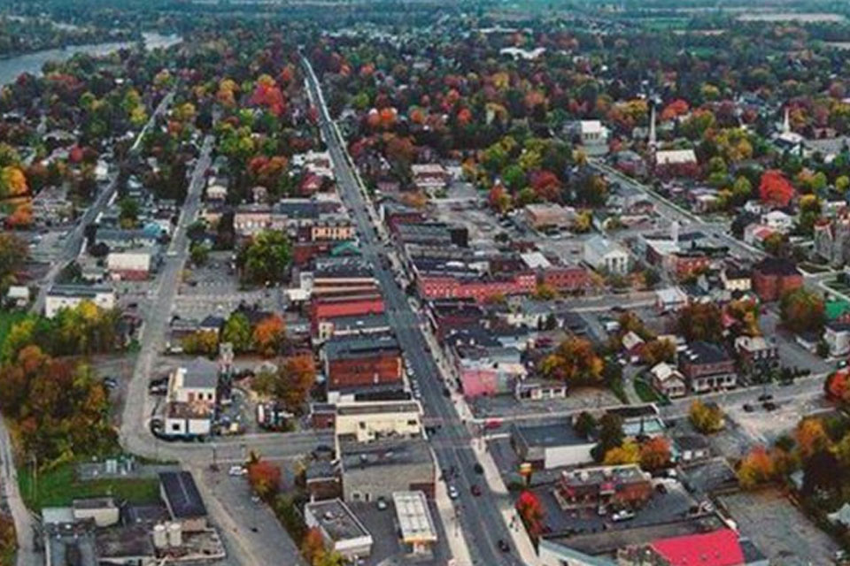 an aerial view of a city with a river running through it.