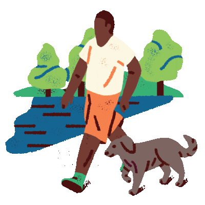 A man walking his dog in a park.