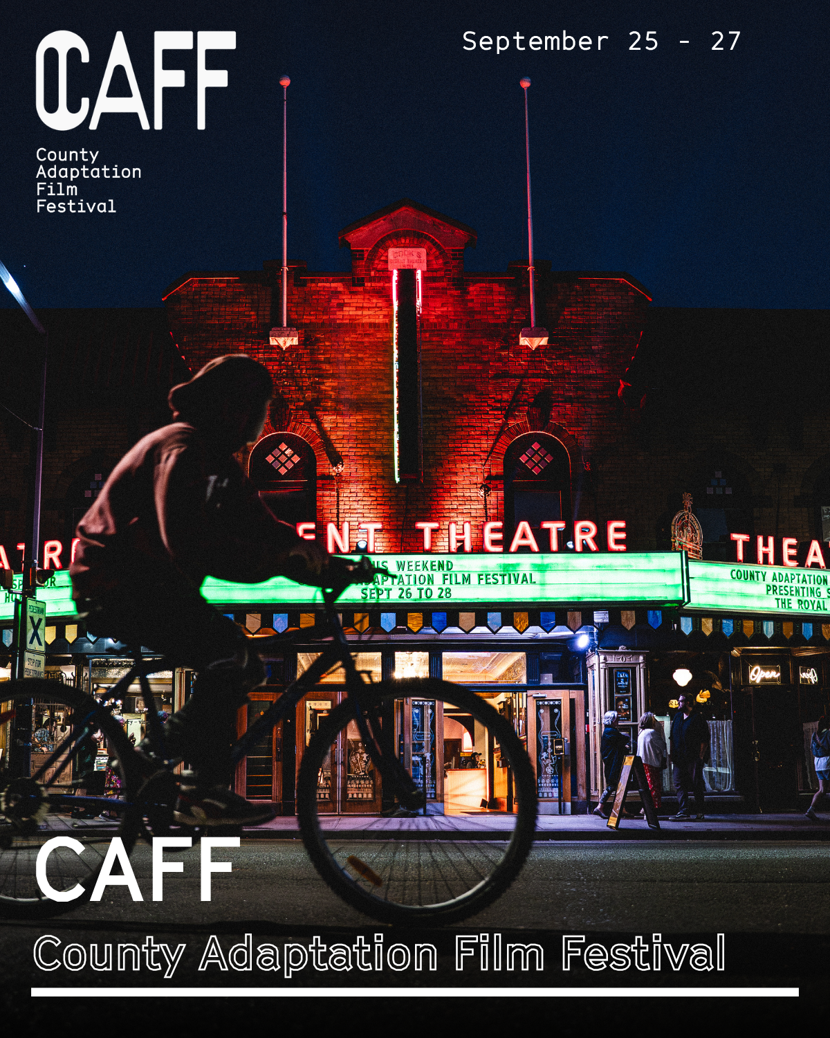 riding a bicycle in front of theatre