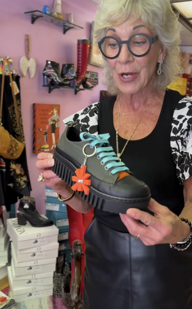 Image of a woman holding a shoe