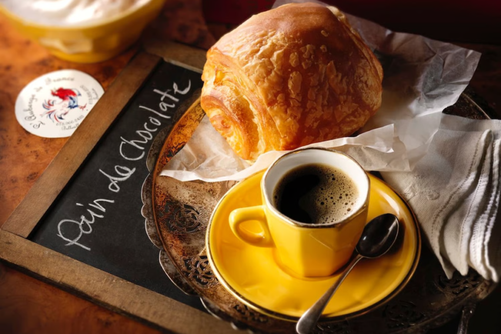 Image of an espresso and croissant